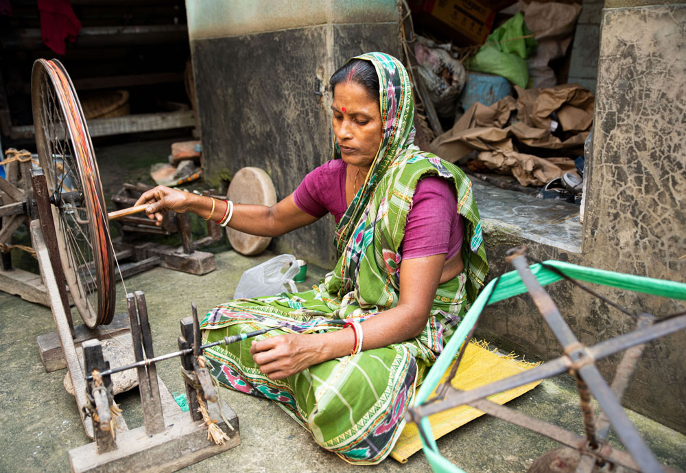 Women artisan weaving fabric