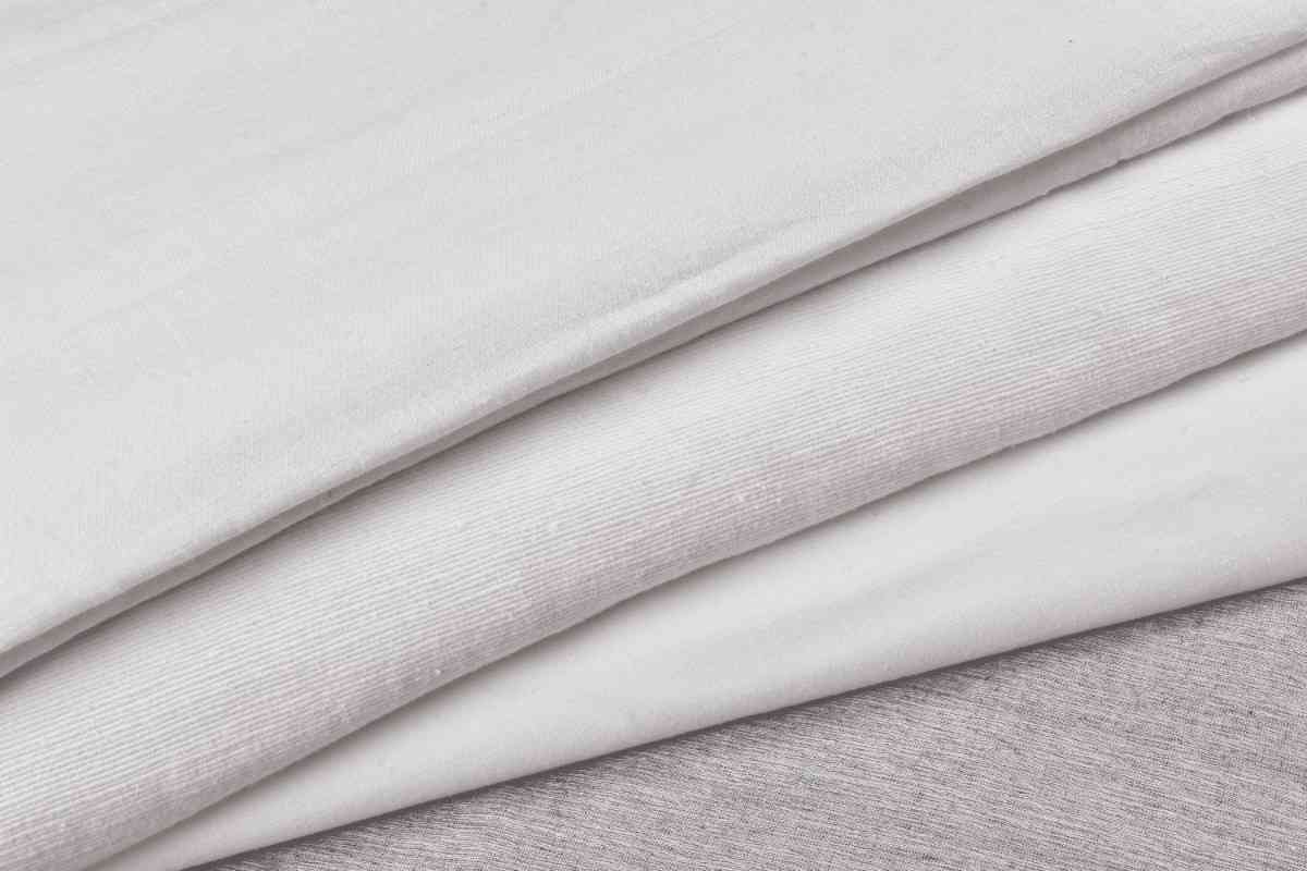 Folded Bamboo Silk fabric showcasing its soft texture, natural sheen, and lightweight handwoven finish.