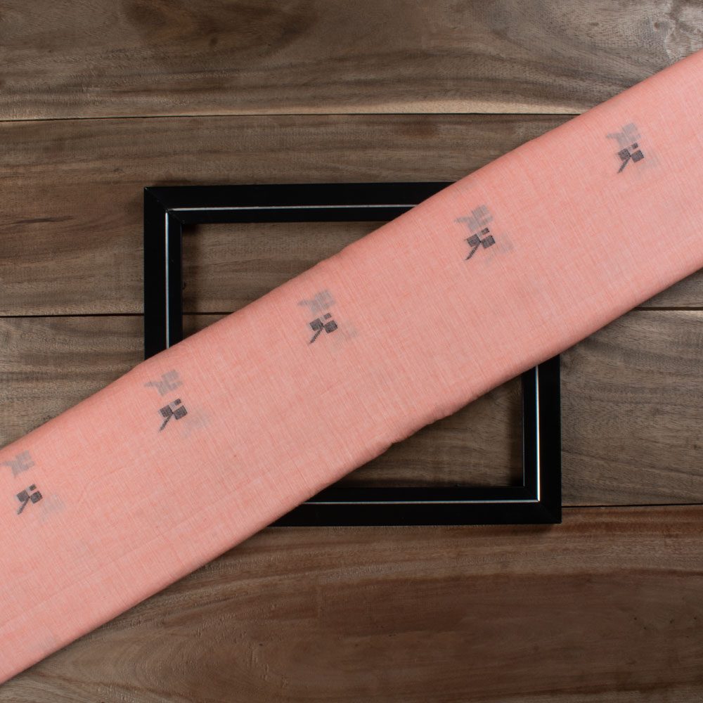 Orange plain cotton Jamdani fabric with black geometric motif folded for product display