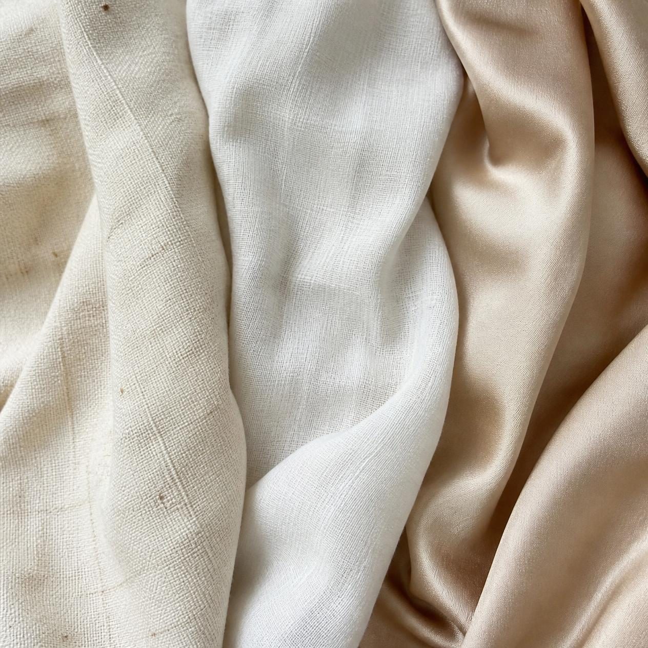 hree natural fabric alternatives to traditional viscose—textured khadi cotton, handwoven cotton, and smooth silk fabrics displayed together.