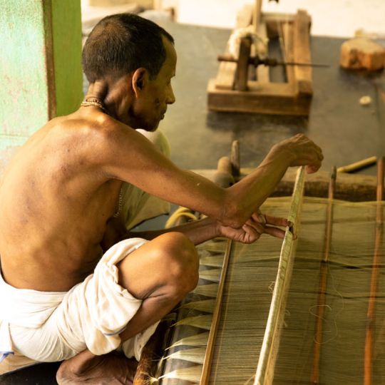 Artisan working on handloom