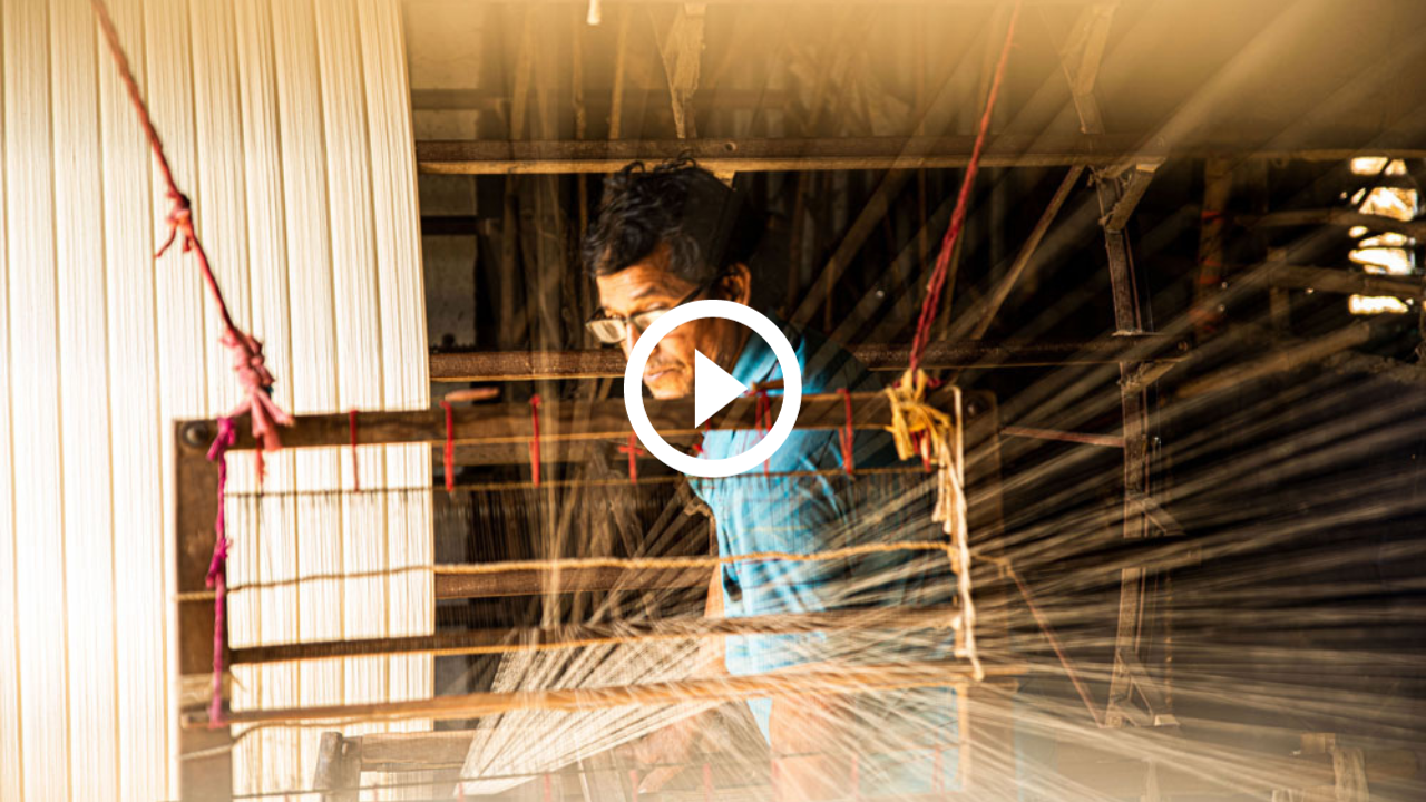 Handloom Weaver Working on Weaving Yarn