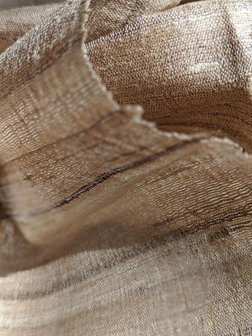 Woven banana fiber fabric showing natural textile texture and weave.