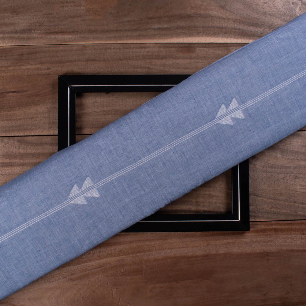 Blue plain cotton Jamdani fabric with white arrow motif folded for product display