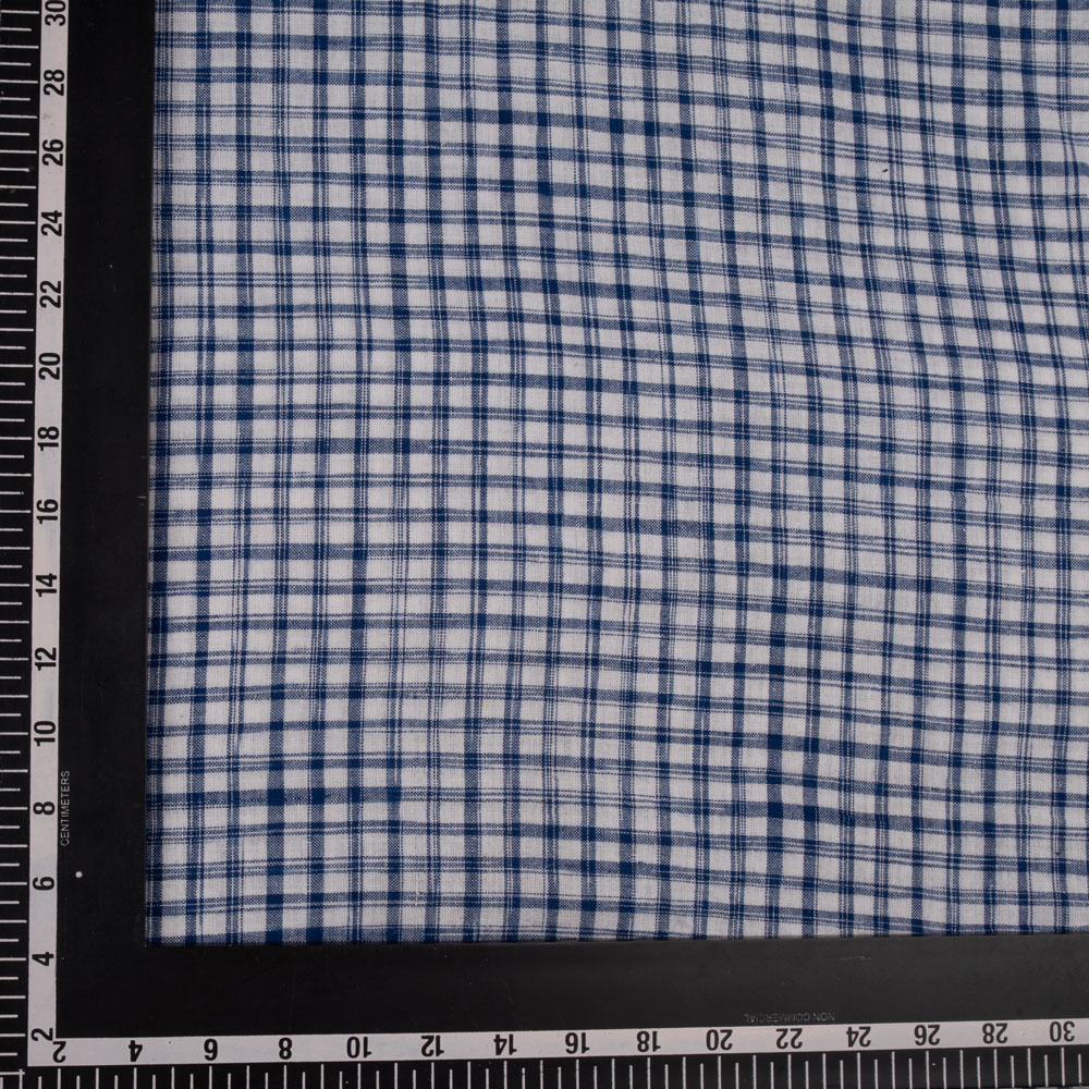 Navy and white tie-dye fabric with a check pattern