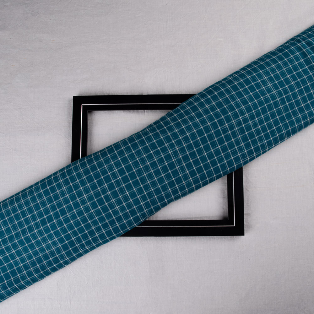 Teal tie-dye fabric with a check pattern