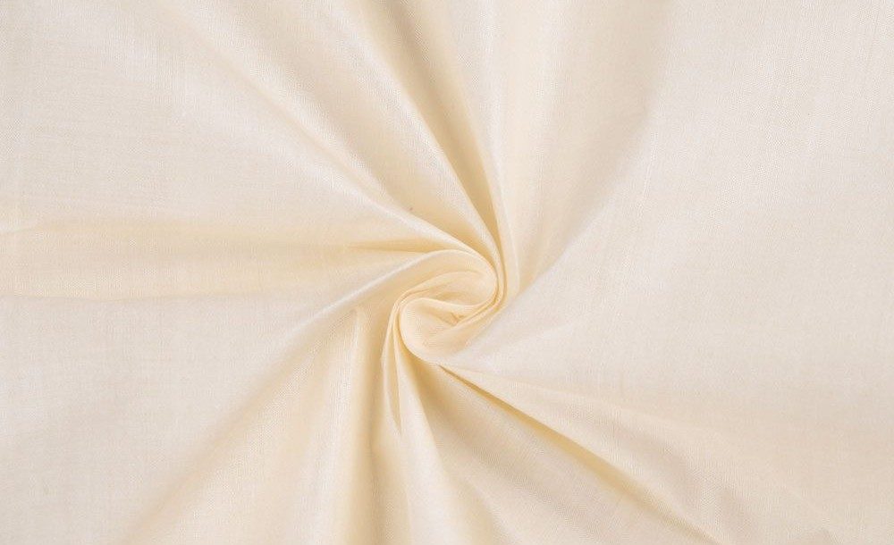 Soft ivory Eri silk fabric with a smooth, gently draped texture