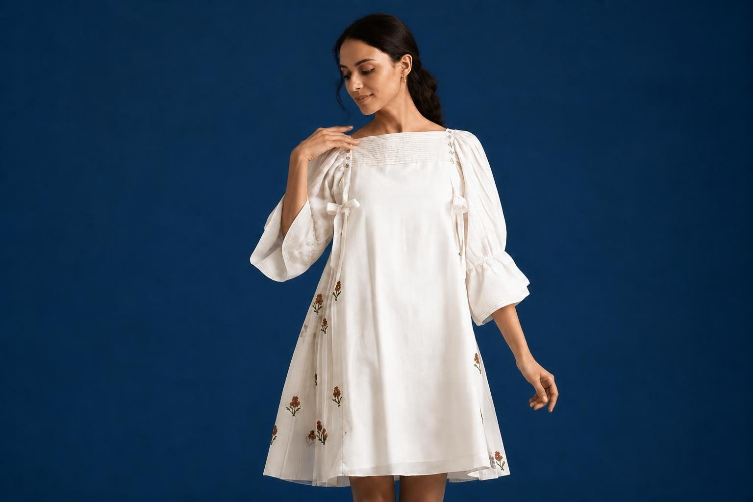 Embroidered pintuck dress with tassels by Anuprerna for Durga Puja