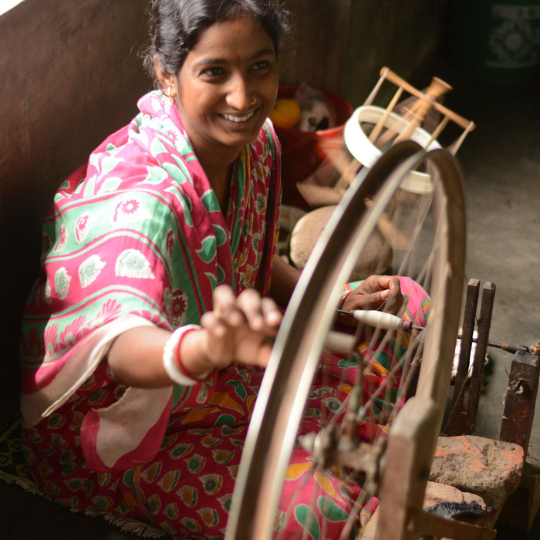 Women Spinning yarns on Charkha