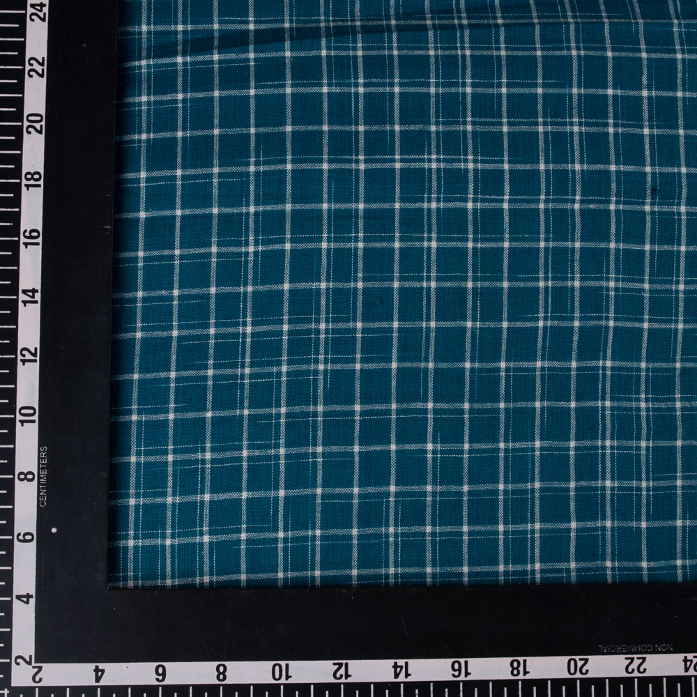 Teal tie-dye fabric with a check pattern