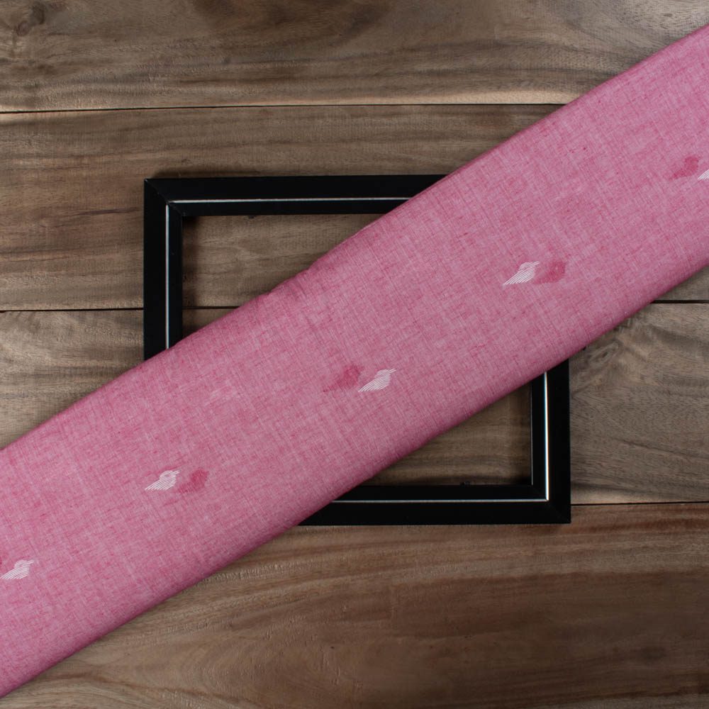 Pink plain cotton Jamdani fabric with white and pink bird motif folded for product display