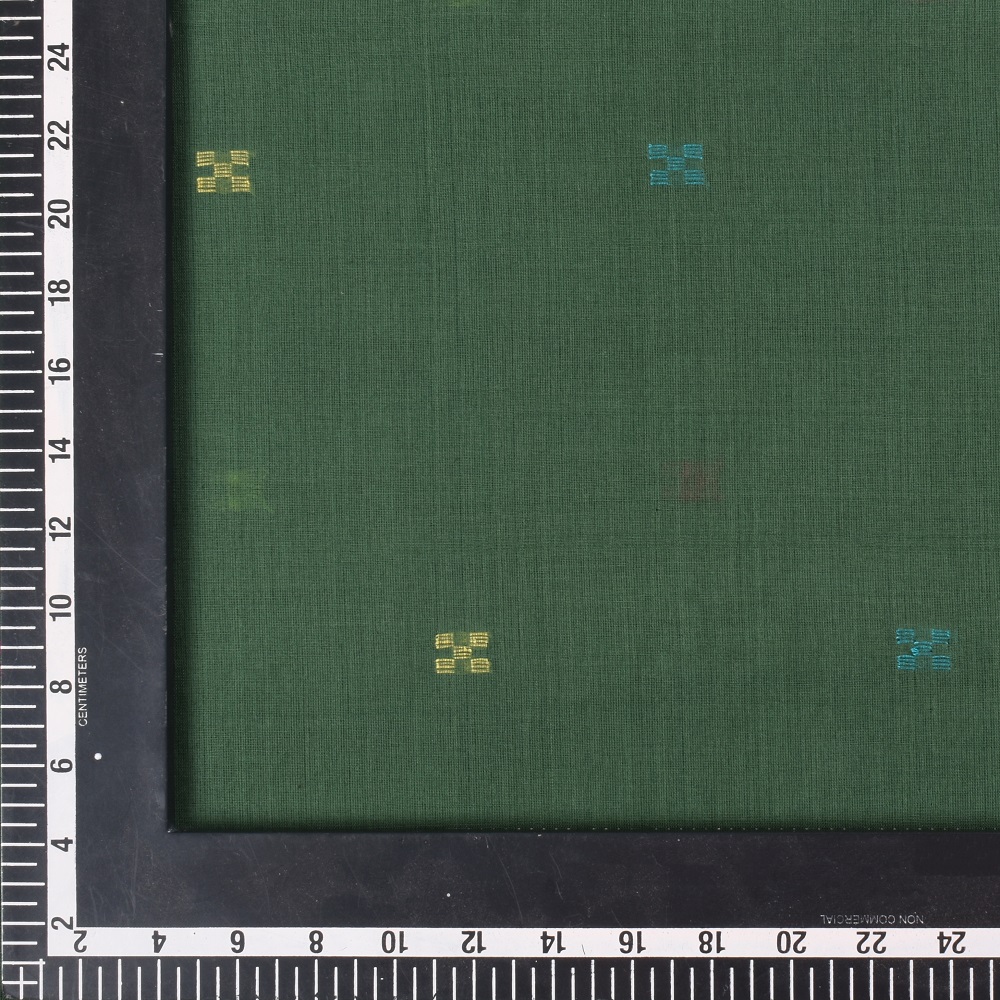 Vibrant green Jamdani fabric featuring a bold geometric pattern