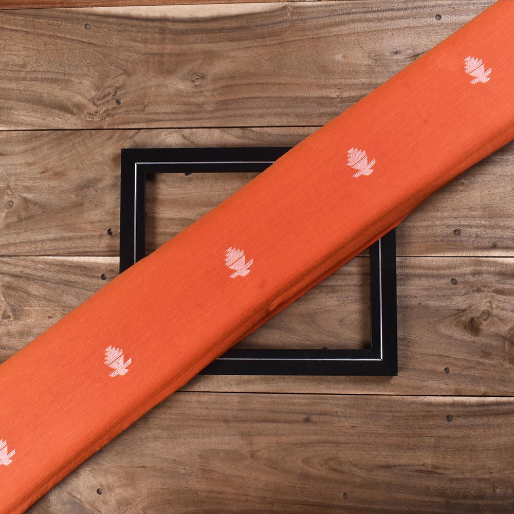 Orange Jamdani fabric featuring a geometric pattern