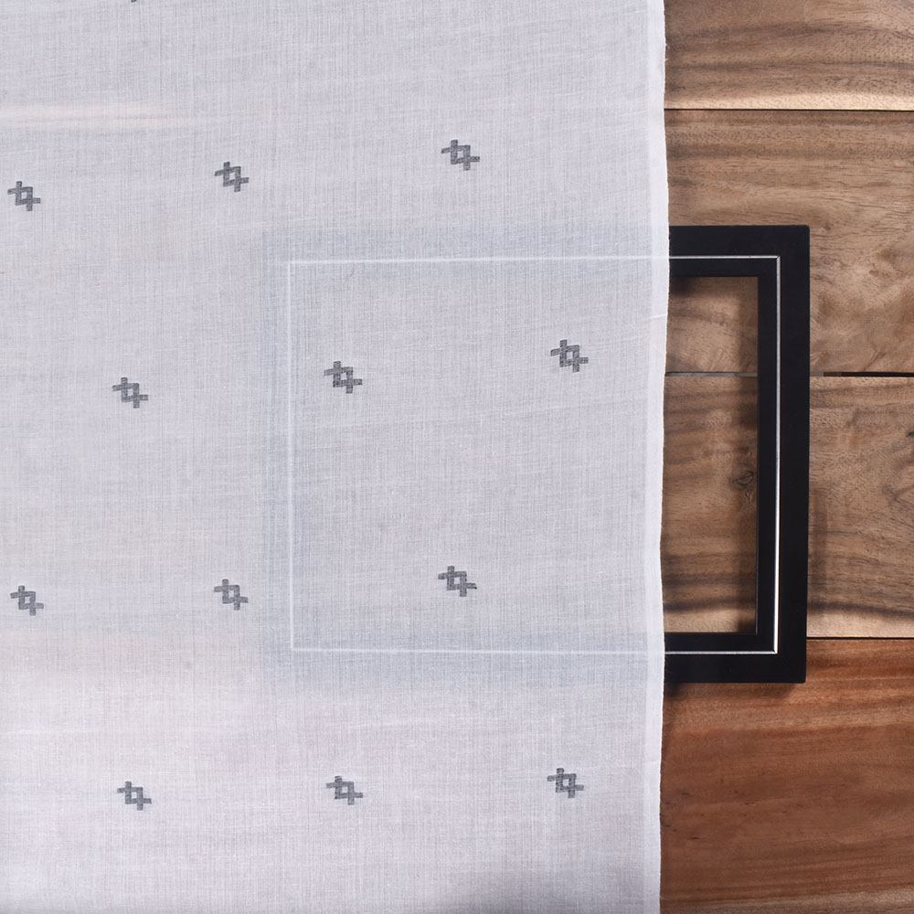 Black white Jamdani fabric featuring a striking geometric pattern