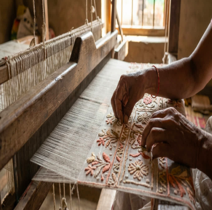 The meticulous precision of Indian handloom artistry, crafting fabrics that meet the highest global standards.