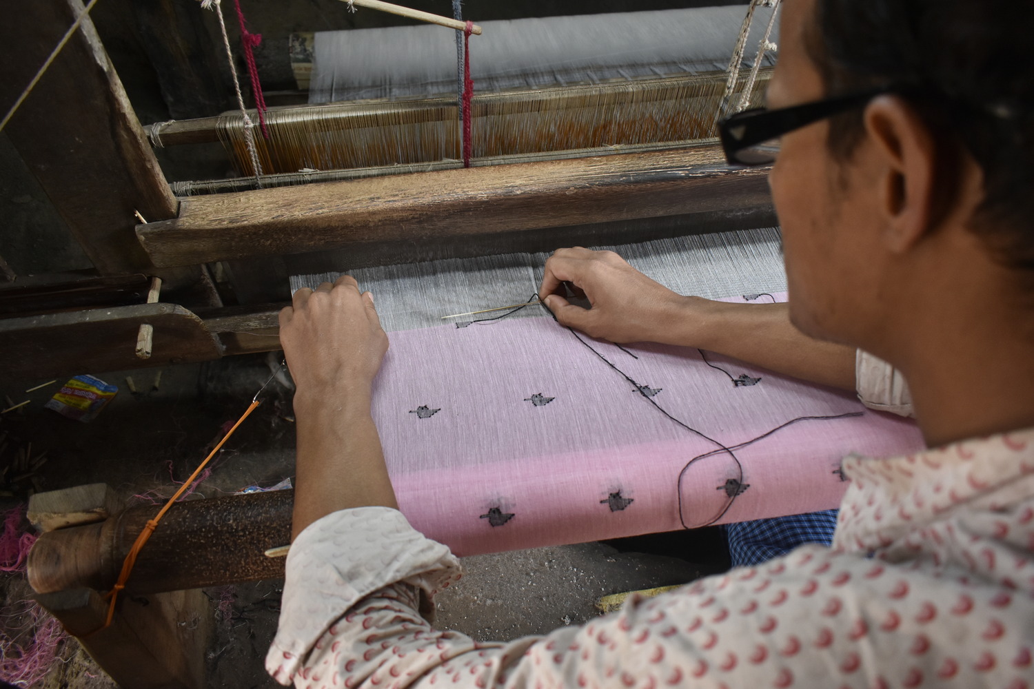 Artisan weaving jamdani fabric